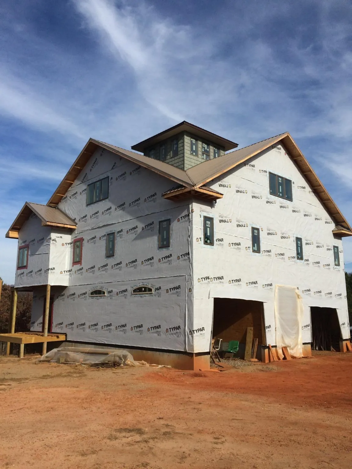 New two story house under construction with a cupola and gabled roofs in Umpqua